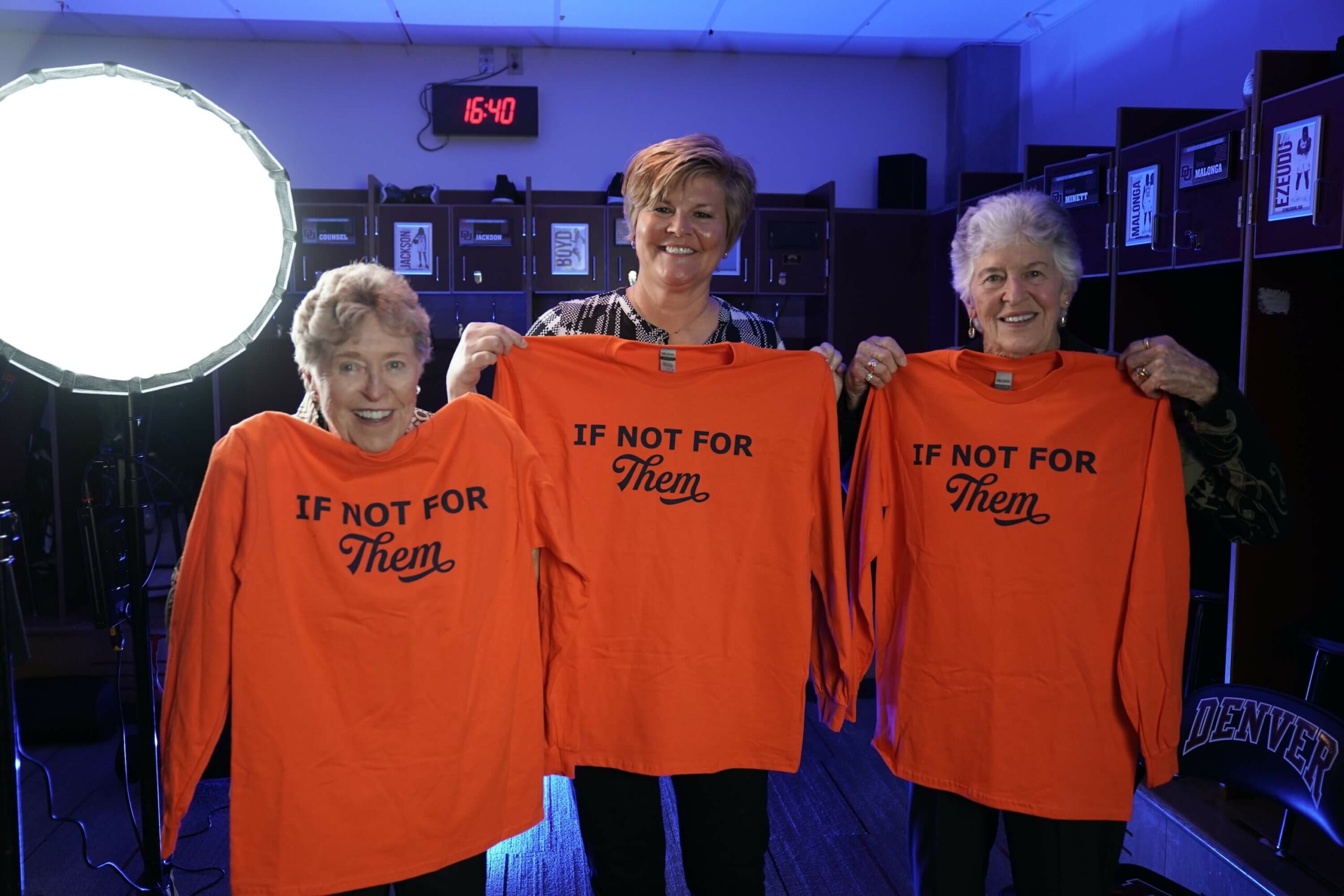 Alice "Cookie" Barron, Brenda VanLengen and Kaye Garms model the If Not For Them orange longsleeve shirts